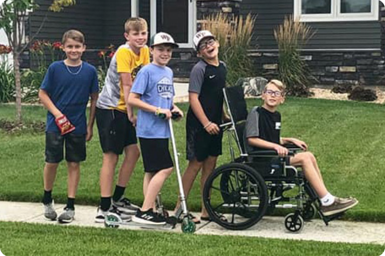 Landon taking a stroll down the block with his best friends.