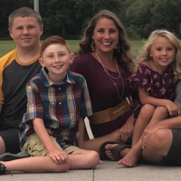 Brad and Sara Schenck with their three young kids.